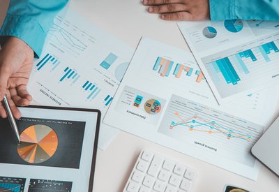 Financial businessman analyze the graph of the company's performance to create profits and growth