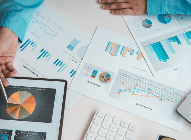 Financial businessman analyze the graph of the company's performance to create profits and growth